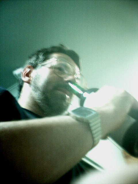 David puts a bottle up his nose while large phone bills are created.