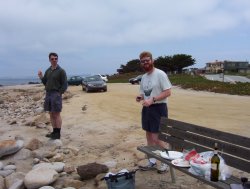 Lunch at Monterey - David and Rupert try not to shiver as Patrick takes a photo and Mark hops over rocks somewhere out of shot