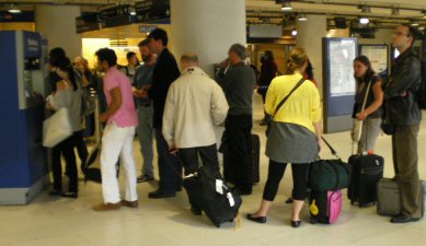 If you see the bloke in the pink shirt, pick another queue